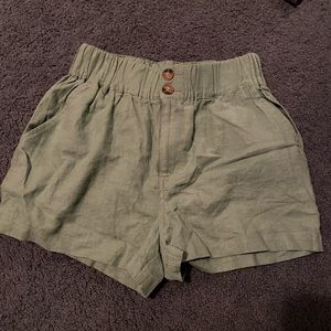 green loose shorts